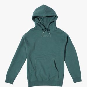 Glossier green hooded sweatshirt.
